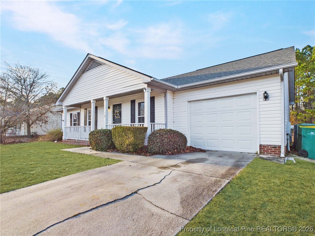 4403 Bishamon Street Hope Mills, NC 28348 - Photo 38 of 41 a view of a house with a yard