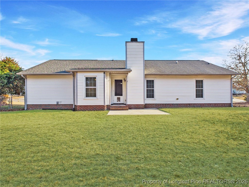 4403 Bishamon Street Hope Mills, NC 28348 - Photo 40 of 41 a front view of house with yard and porch