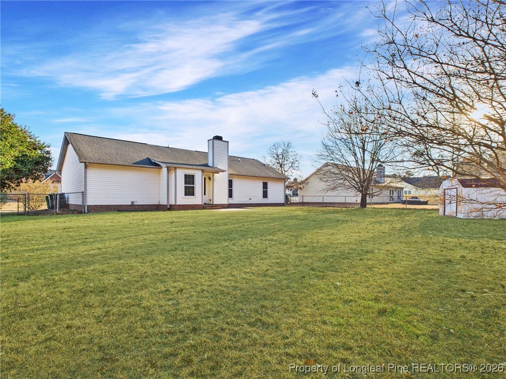 4403 Bishamon Street Hope Mills, NC 28348 - Photo 41 of 41 a front view of house with yard and trees in the background