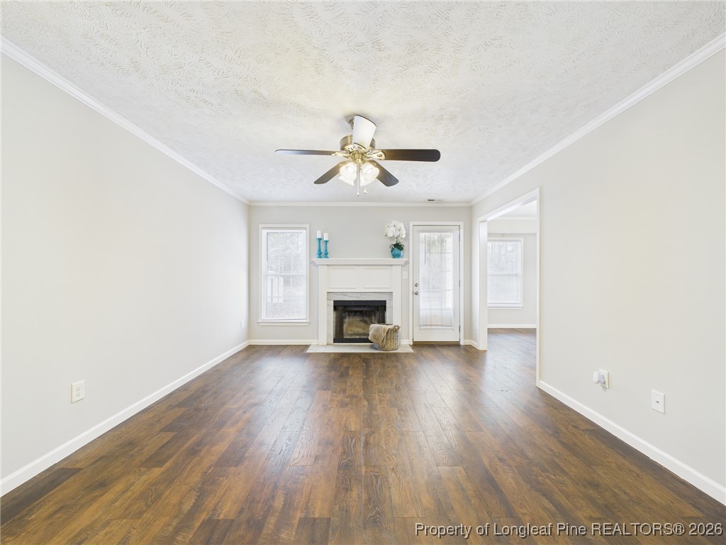 4403 Bishamon Street Hope Mills, NC 28348 - Photo 8 of 41 a view of an empty room with a fireplace and a window