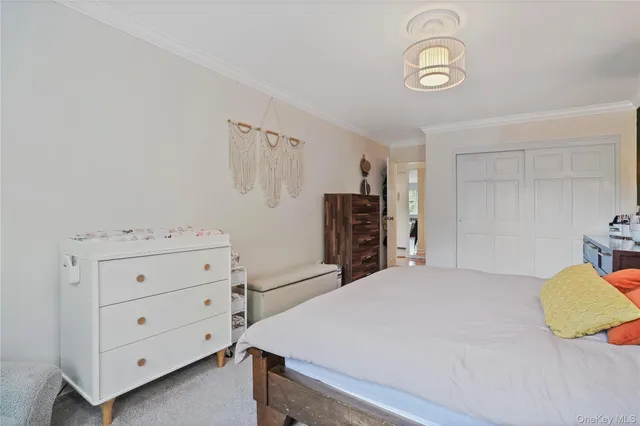 a bedroom with a bed and cabinets