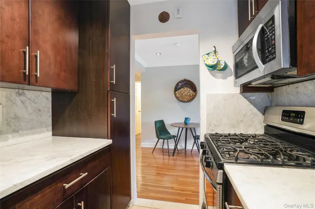 a kitchen with a stove and a microwave