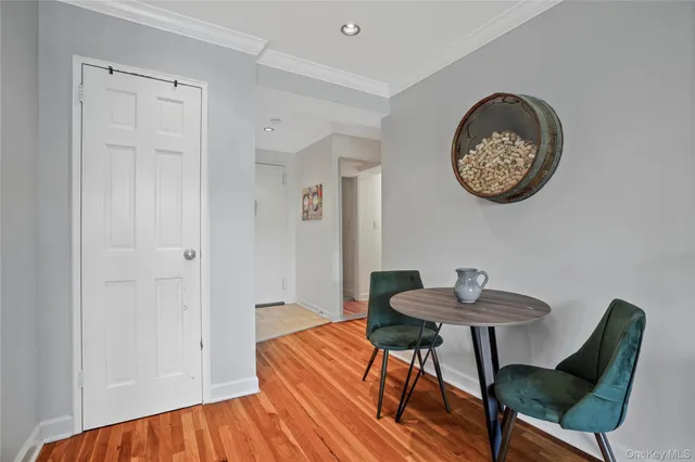 a view of a room with a table and chairs