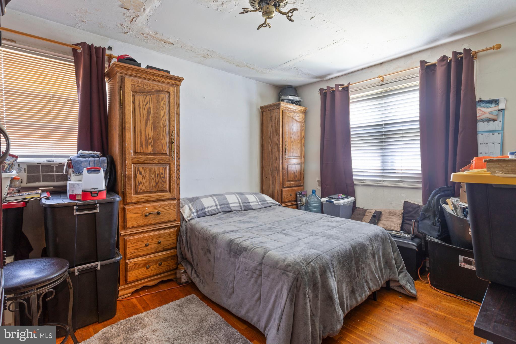 5425 Whitlock Road Baltimore, MD 21229 - Photo 18 of 30 a bedroom with a bed and two windows