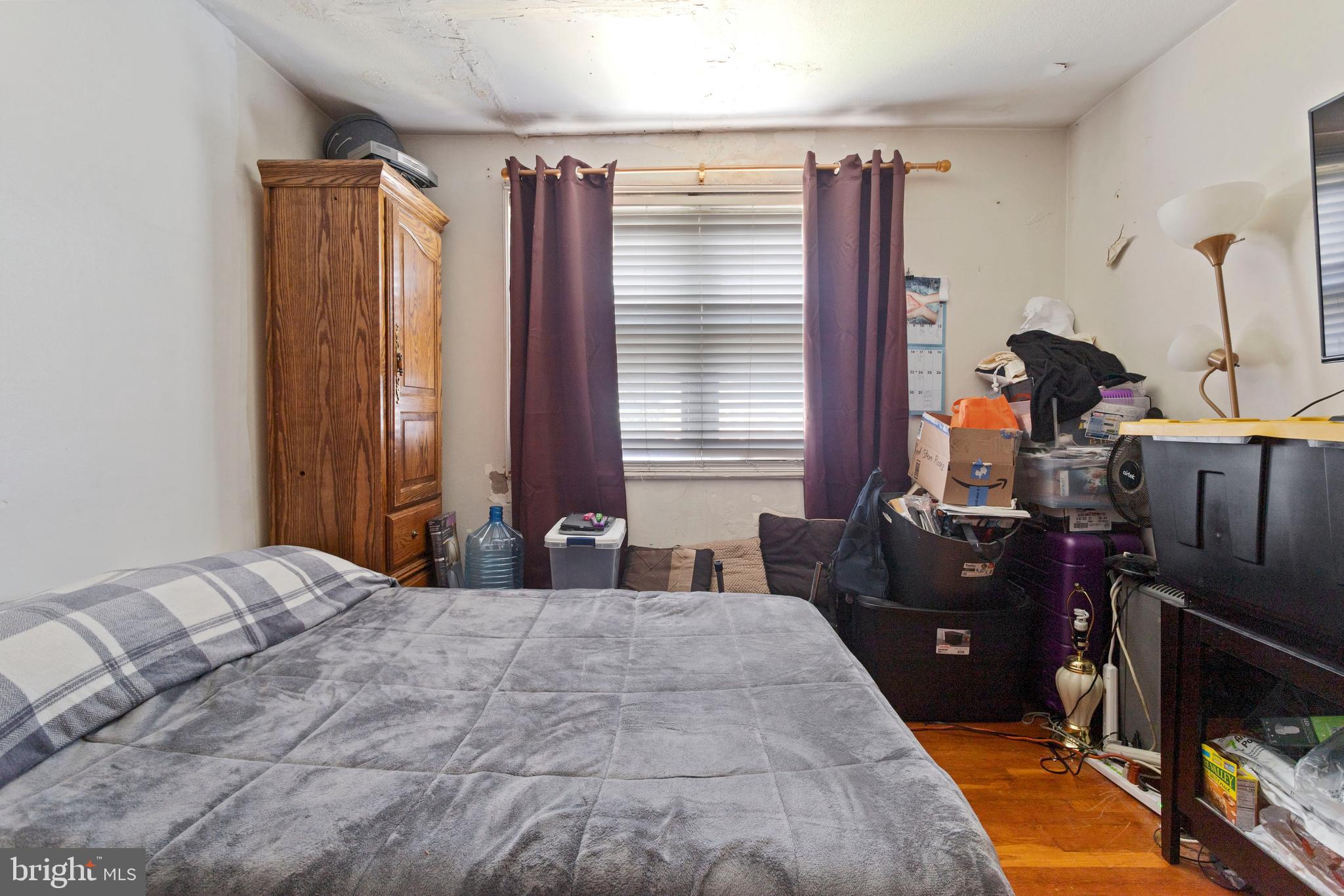 5425 Whitlock Road Baltimore, MD 21229 - Photo 19 of 30 a bedroom with a bed and a dresser