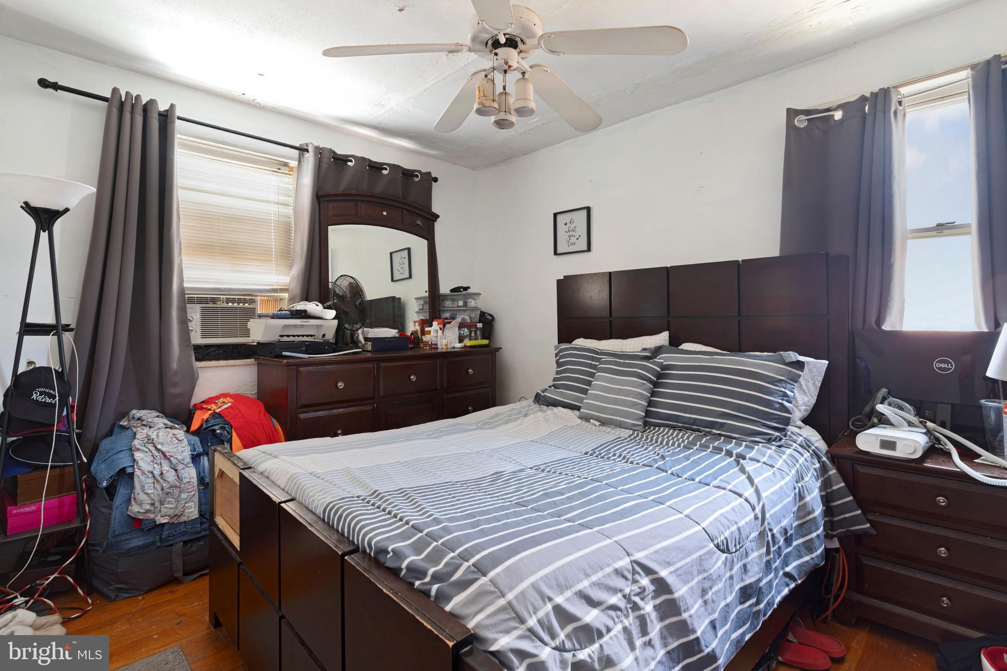 5425 Whitlock Road Baltimore, MD 21229 - Photo 21 of 30 a bedroom with a bed and wooden floor
