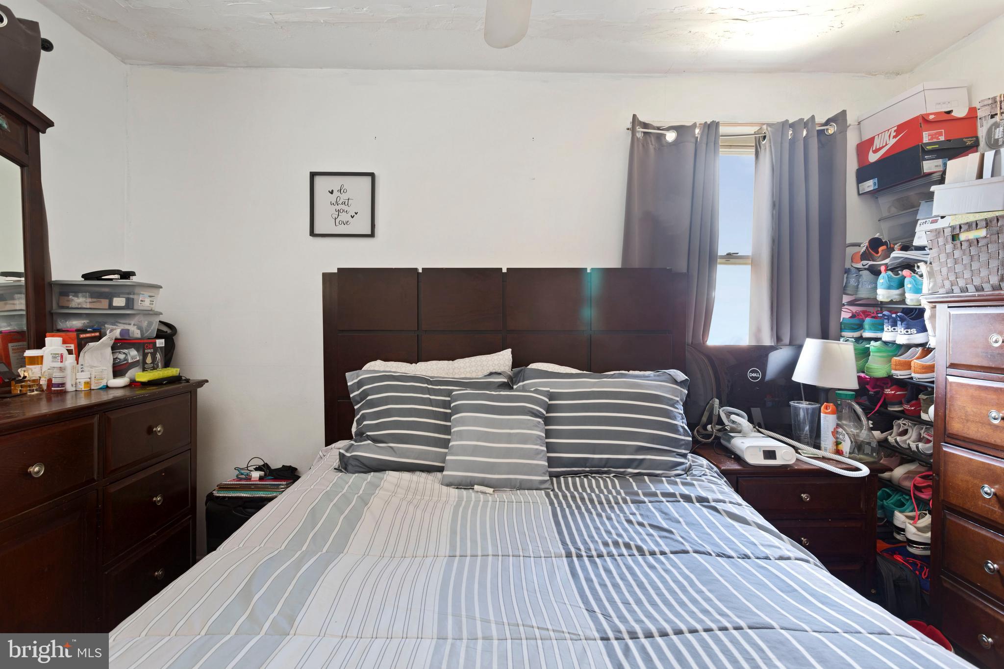 5425 Whitlock Road Baltimore, MD 21229 - Photo 22 of 30 a bedroom with a bed and a dresser