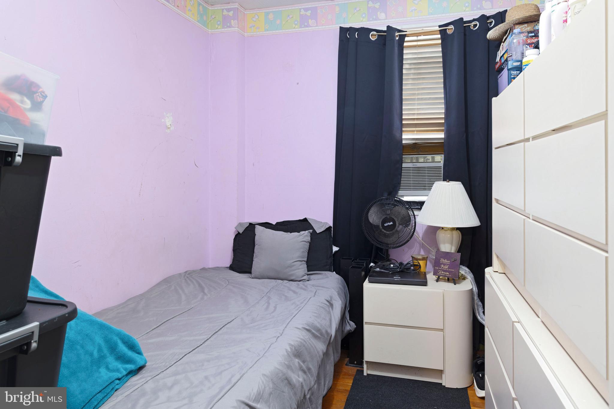5425 Whitlock Road Baltimore, MD 21229 - Photo 24 of 30 a bedroom with a bed dresser and a window