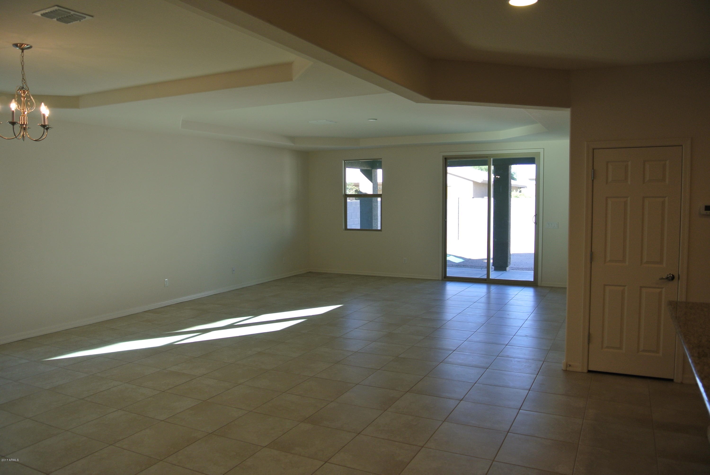 2428 West Beverly Rd. Phoenix, AZ 85041 - Photo 9 of 19 Family room before paint and crown