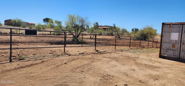 a view of a backyard of the house