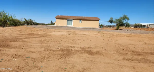 a living room with lots of furniture and a rug