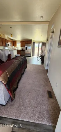 a living room with furniture and flat screen tv