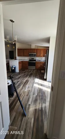 a living room with furniture pool table and a window