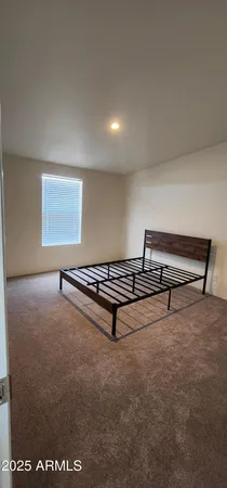 a view of a room with stairs and wooden floor