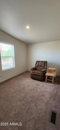 a view of an empty room and fire place