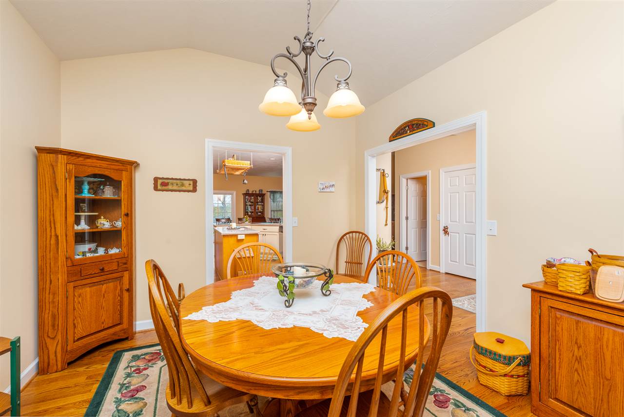 283 Round Hill School Road Fort Defiance, VA 24437 - Photo 19 of 48 a dining room with furniture and wooden floor