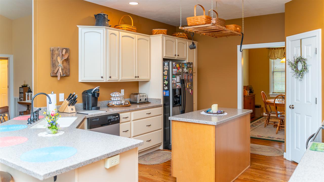 283 Round Hill School Road Fort Defiance, VA 24437 - Photo 26 of 48 a kitchen with stainless steel appliances granite countertop a sink a stove and refrigerator