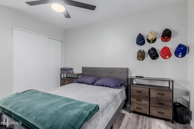 a bathroom with a granite countertop sink mirror and toilet