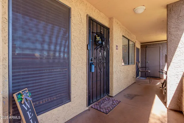 a living room with furniture and a clock