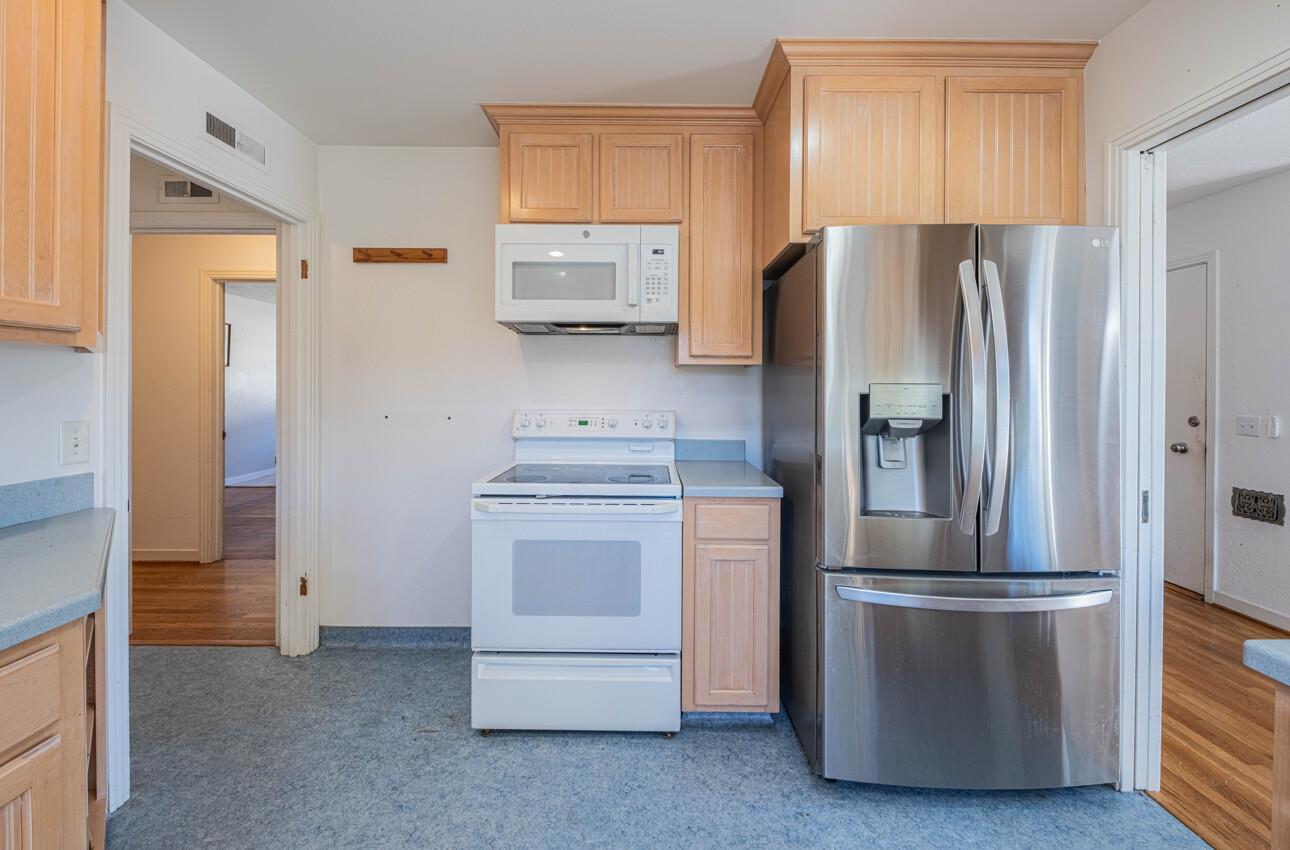 194 Riker Terrace Salinas, CA 93901 - Photo 13 of 36 a kitchen with stainless steel appliances granite countertop a refrigerator and a stove