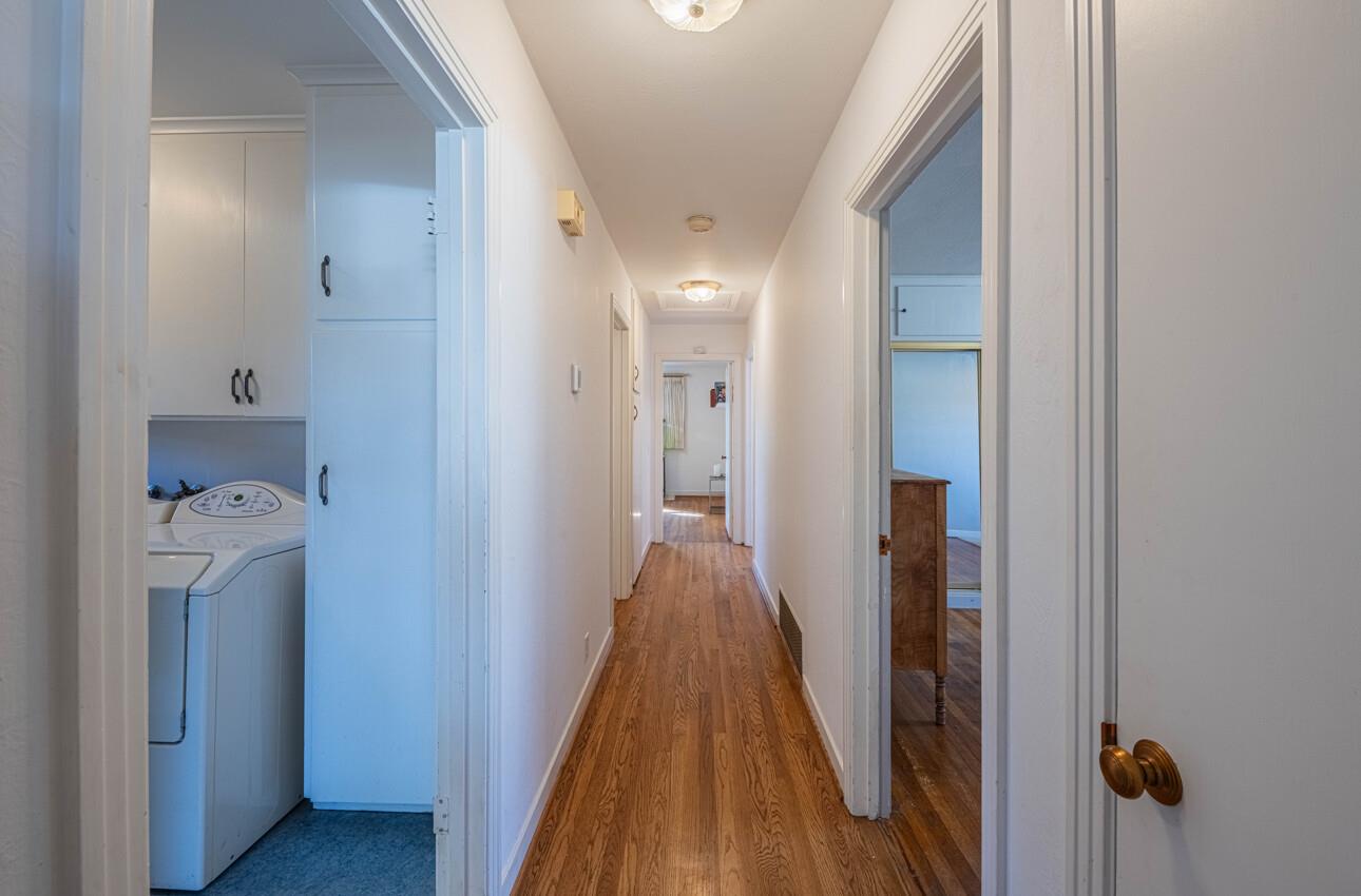 194 Riker Terrace Salinas, CA 93901 - Photo 20 of 36 a view of a hallway with wooden floor and a bathroom