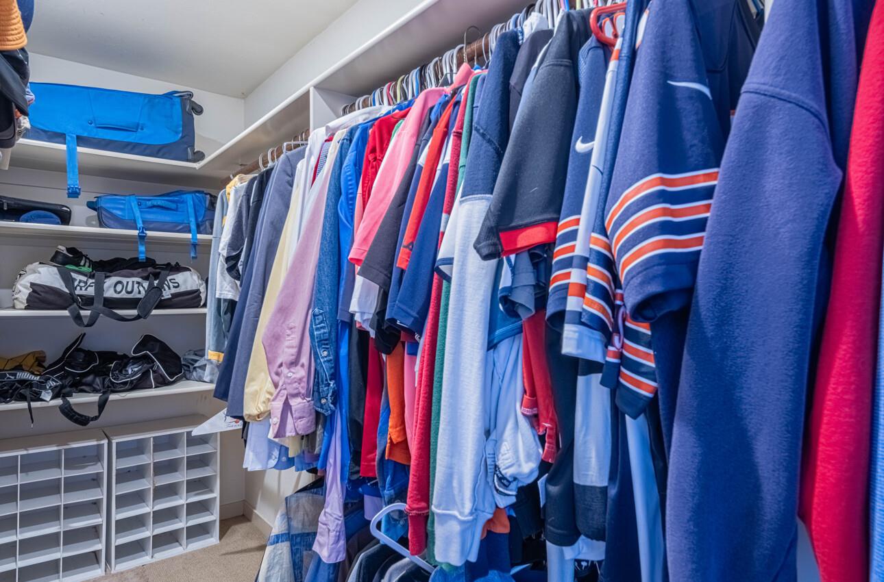 194 Riker Terrace Salinas, CA 93901 - Photo 23 of 36 a view of walk in closet with clothes and shoes
