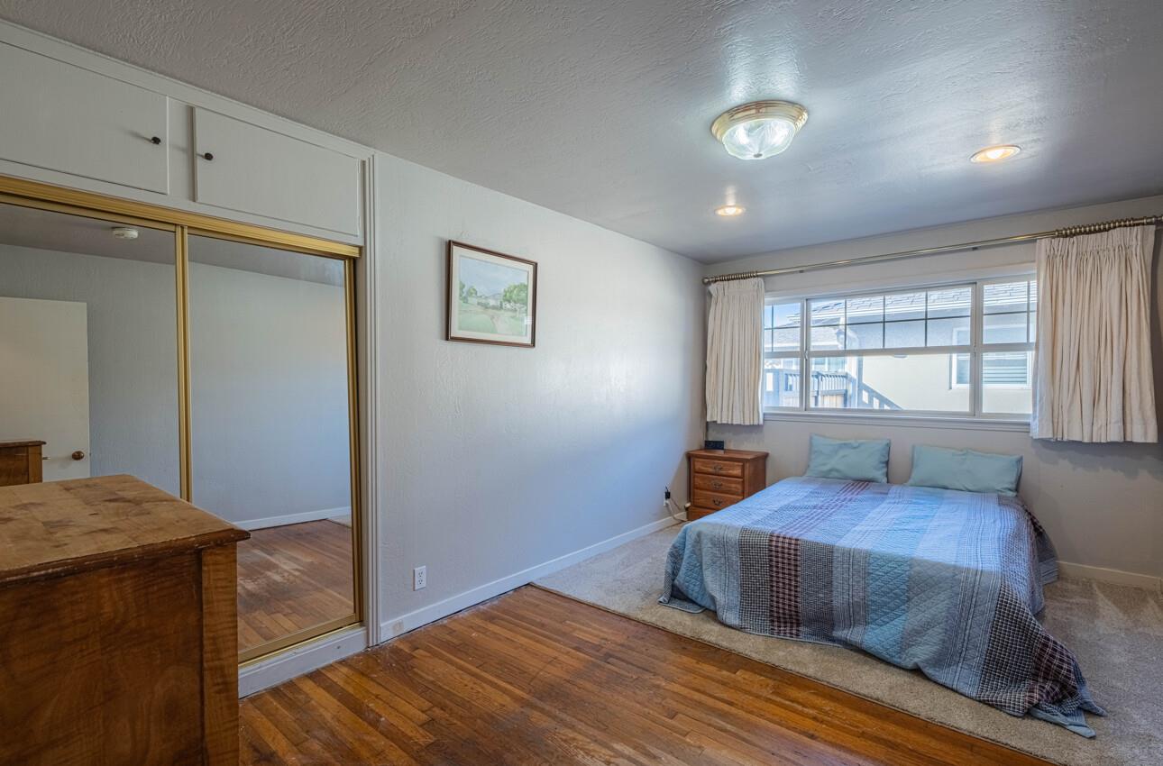 194 Riker Terrace Salinas, CA 93901 - Photo 27 of 36 a bedroom with a bed and a window