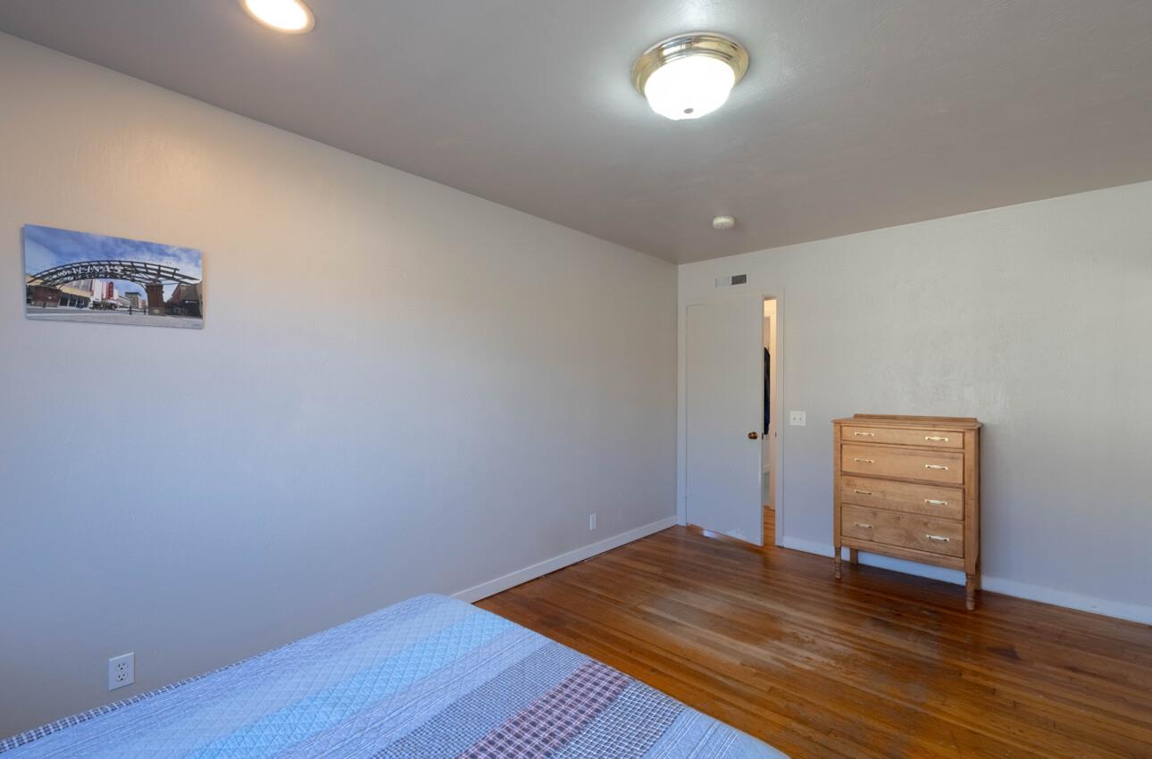 194 Riker Terrace Salinas, CA 93901 - Photo 28 of 36 an empty room with wooden floor cabinet and windows