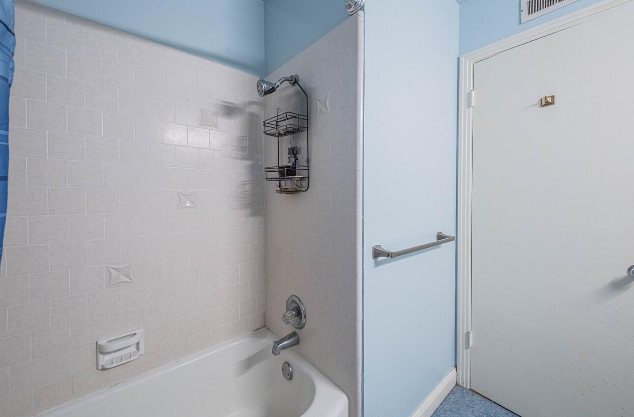 194 Riker Terrace Salinas, CA 93901 - Photo 32 of 36 a bathroom with a bathtub and a shower