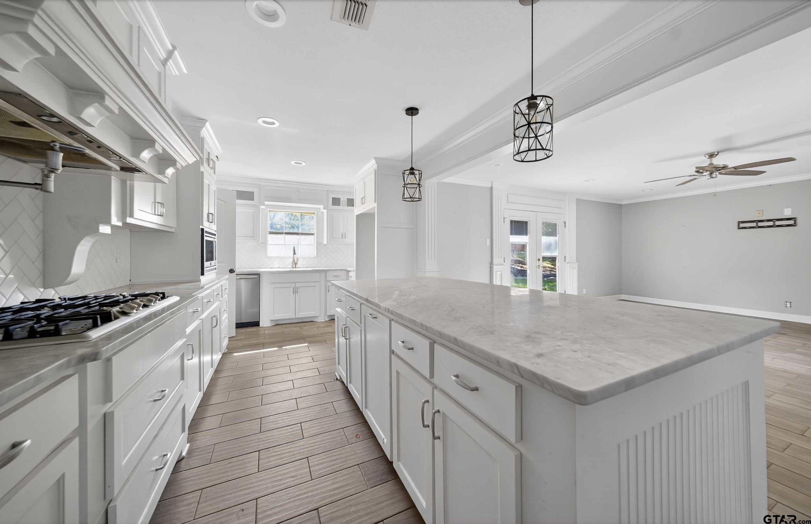 3408 Jackson Avenue Tyler, TX 75705 - Photo 11 of 45 a kitchen with a stove and a sink