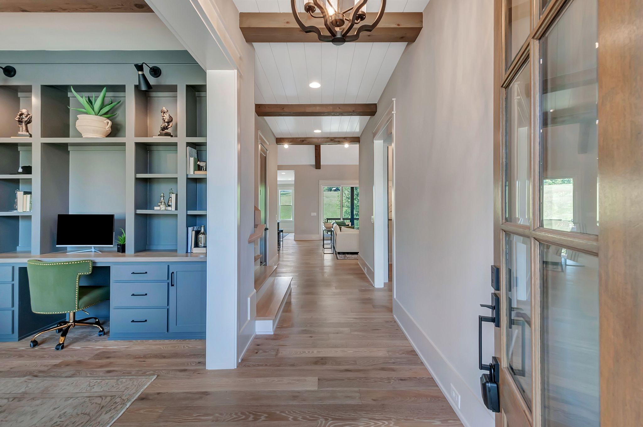 343 Circuit Road Franklin, TN 37064 - Photo 4 of 68 a view of a hallway with workspace and wooden floor