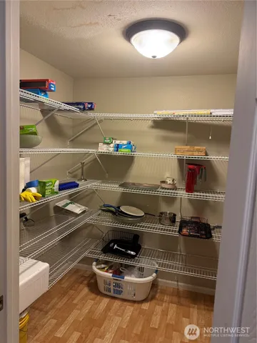 a kitchen with a stove and a refrigerator