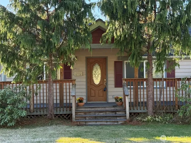 a front view of a house with garden