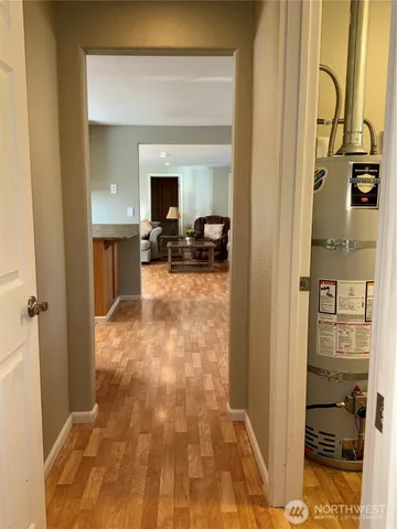 a view of a kitchen from the hallway