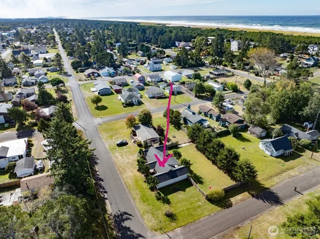 an aerial view of residential houses with outdoor space