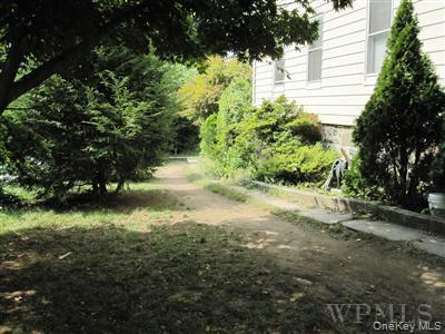 518 Locust Avenue Port Chester, NY 10573 - Photo 5 of 5 a view of a yard with plants and large trees