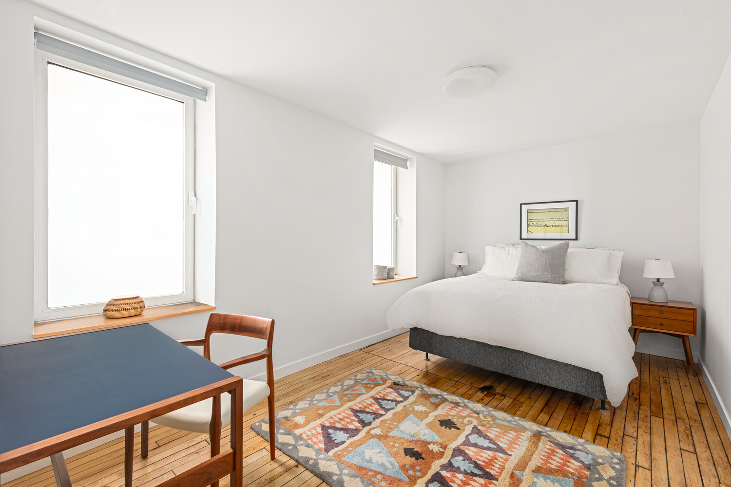 554 Broome Street, Unit 4 Manhattan, NY 10013 - Photo 8 of 13 a bedroom with a bed and a window