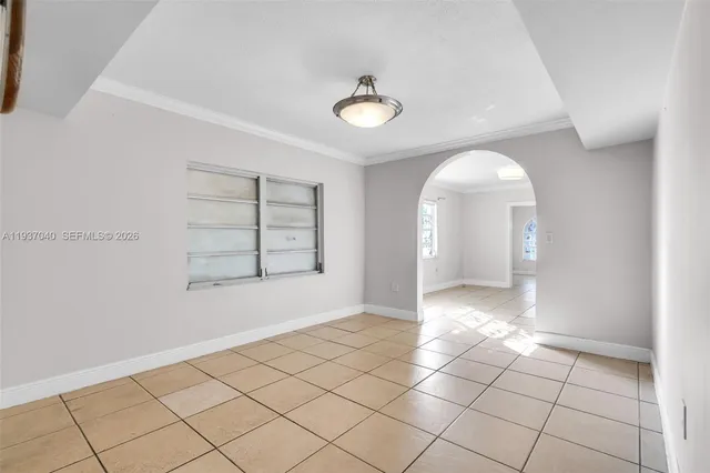 a view of an empty room and window