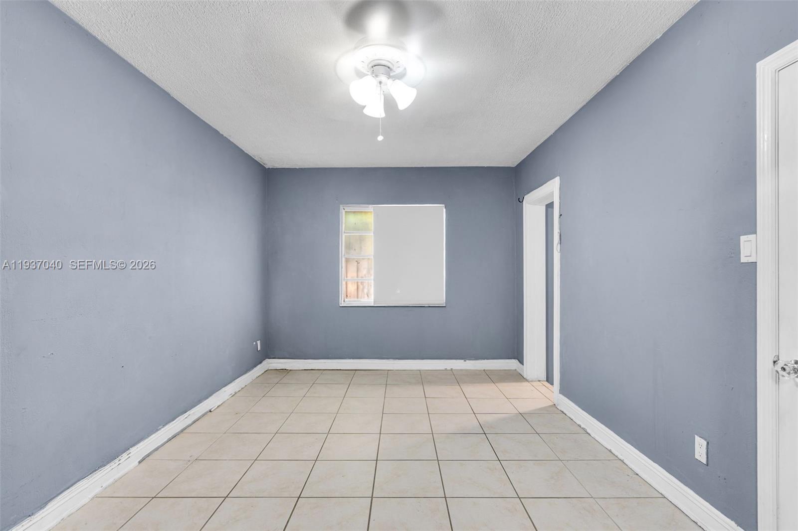 2007 Southwest 60th Avenue Miami, FL 33155 - Photo 17 of 26 a view of an empty room with a window
