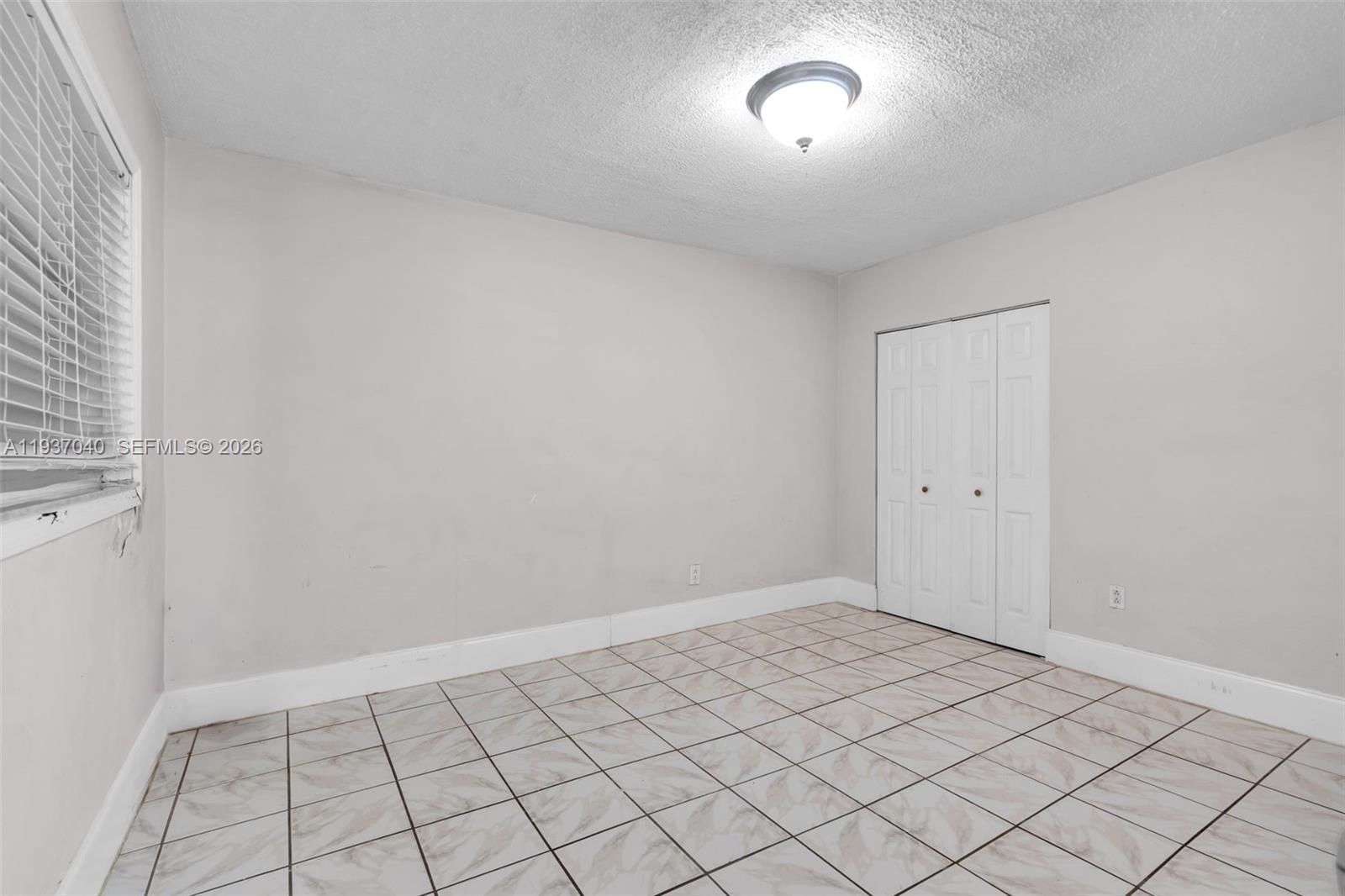 2007 Southwest 60th Avenue Miami, FL 33155 - Photo 19 of 26 a view of an empty room and window