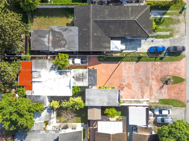 an aerial view of houses with outdoor space