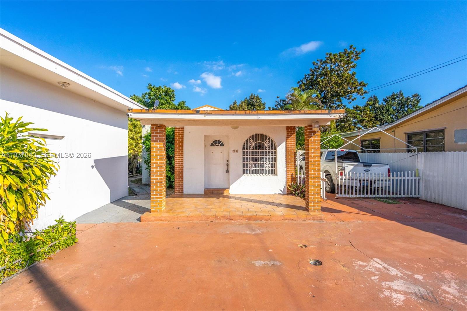 2007 Southwest 60th Avenue Miami, FL 33155 - Photo 4 of 26 a view of a house with a yard