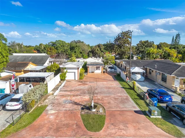a swimming pool with outdoor seating and city view