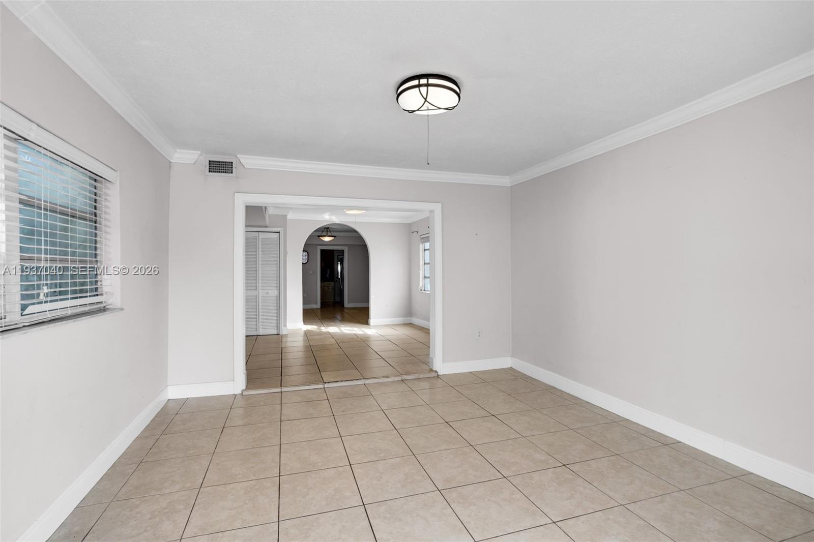 2007 Southwest 60th Avenue Miami, FL 33155 - Photo 6 of 26 a view of an empty room and window