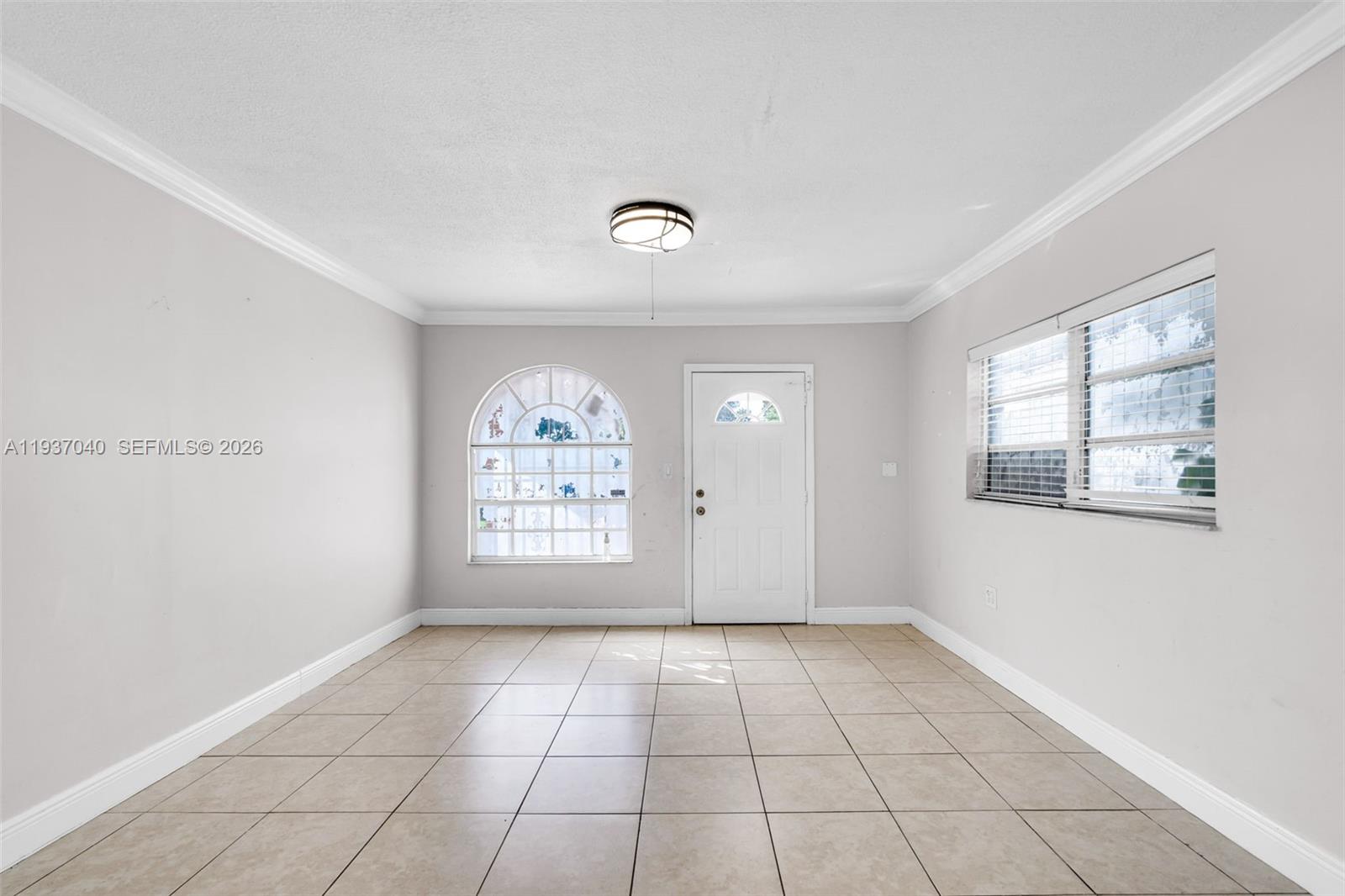 2007 Southwest 60th Avenue Miami, FL 33155 - Photo 7 of 26 a view of an empty room with a window