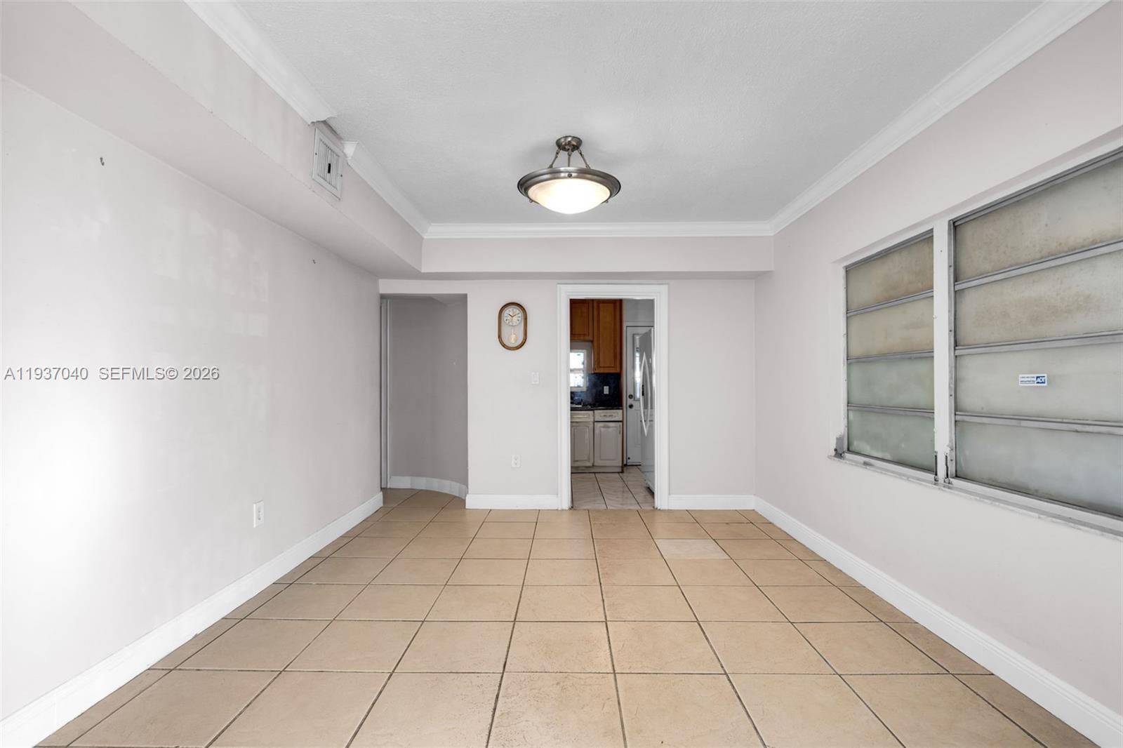 2007 Southwest 60th Avenue Miami, FL 33155 - Photo 10 of 26 a view of an empty room with cabinet and a window