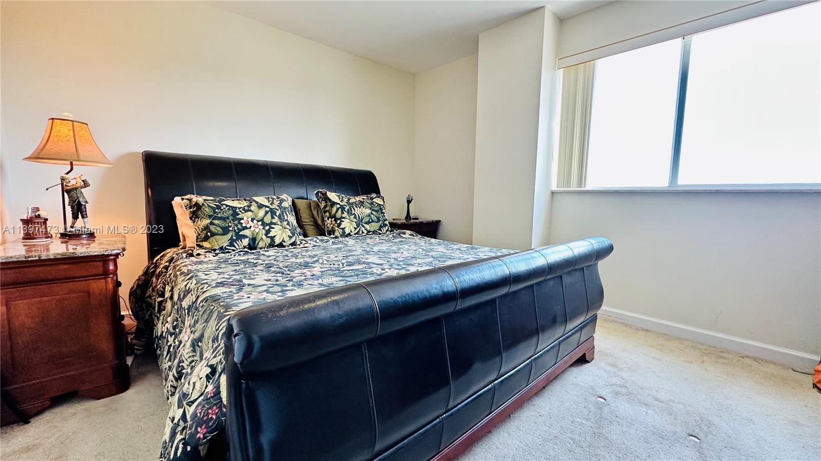 2280 Southwest 32nd Avenue, Unit 315 Miami, FL 33145 - Photo 11 of 21 a bedroom with a bed and a window