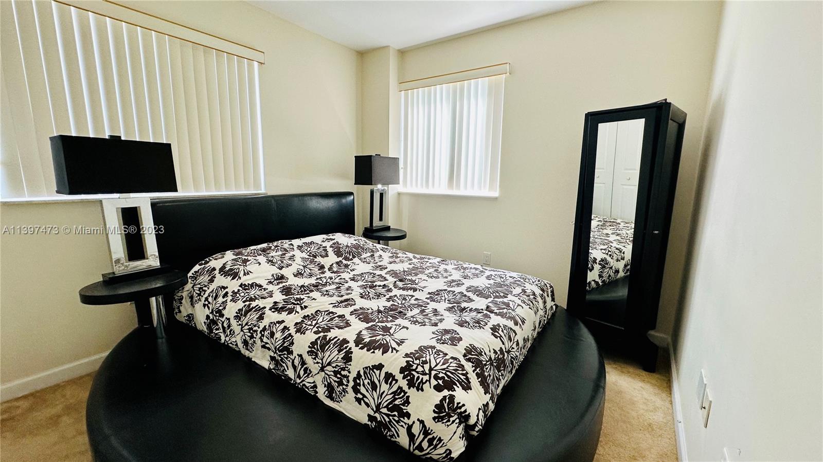 2280 Southwest 32nd Avenue, Unit 315 Miami, FL 33145 - Photo 15 of 21 a bedroom with a bed and a window