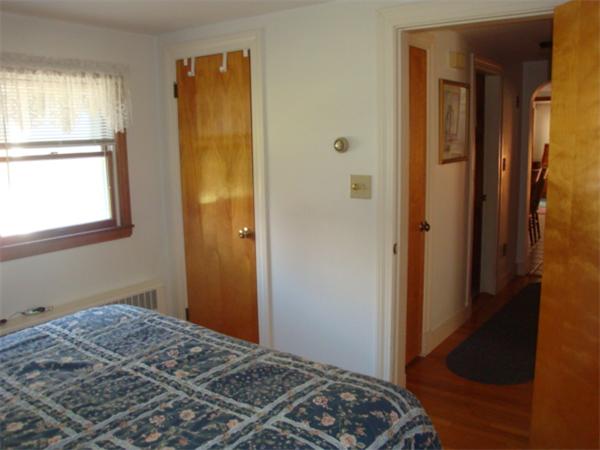 32 Middle Road Amesbury, MA 01913 - Photo 14 of 24 a bedroom with a bed and a window
