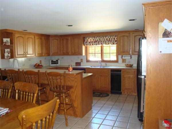 32 Middle Road Amesbury, MA 01913 - Photo 9 of 24 a kitchen with stainless steel appliances granite countertop a refrigerator sink and cabinets